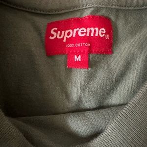 Mint green Supreme men’s shirt.